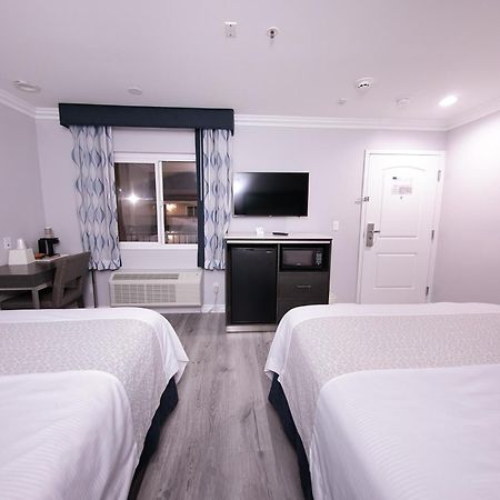 Travelodge Inn & Suites By Wyndham Уест Ковина Стая снимка